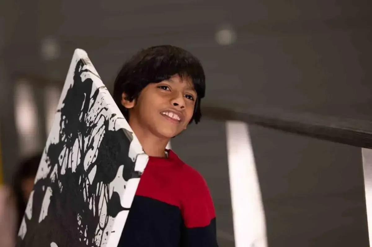 abb_robotics_pixelpaint_art_car_advait_kolarkar_carries_his_zebra_utopia_artwork_on_a_canvas.webp
