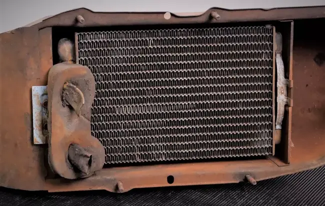 used-heater-core-in-airbox-from-an-old-car.webp