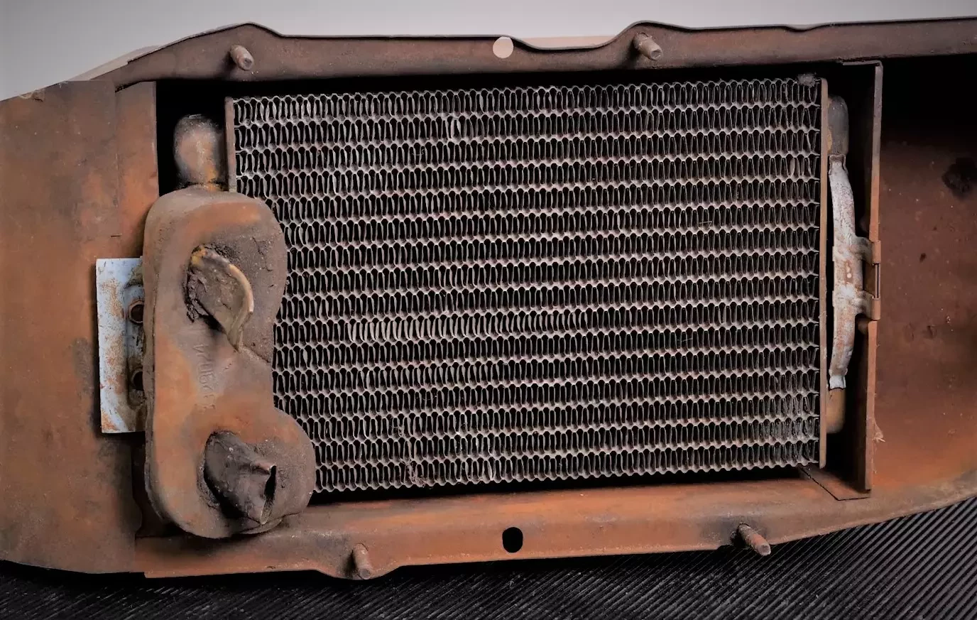 used-heater-core-in-airbox-from-an-old-car.webp